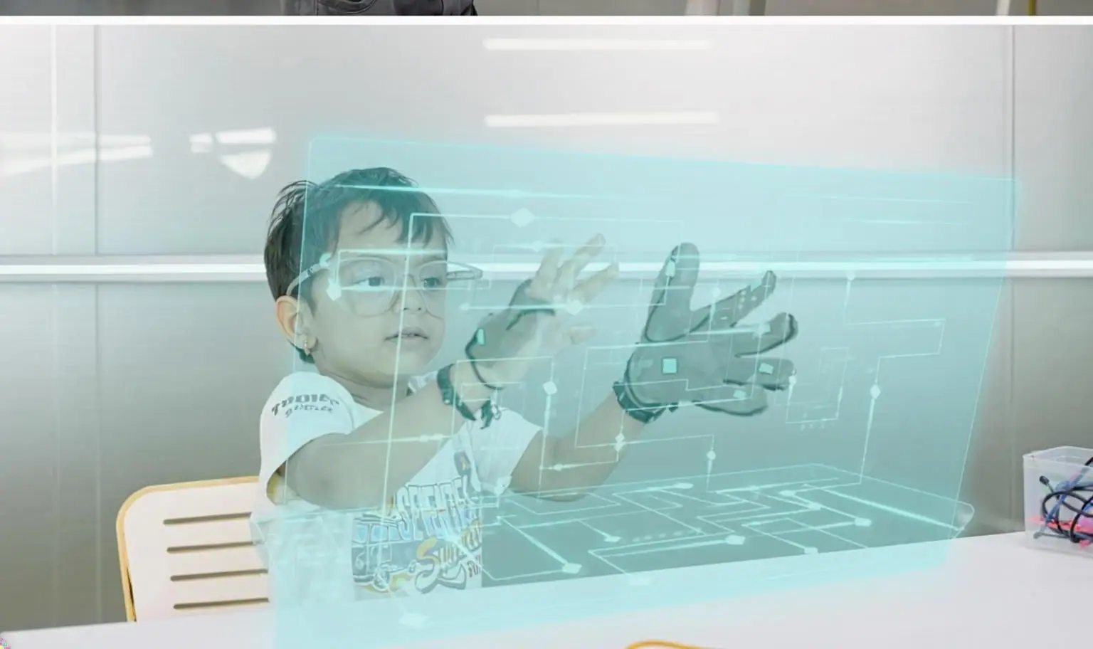 Child using a holographic interface with a smart glove